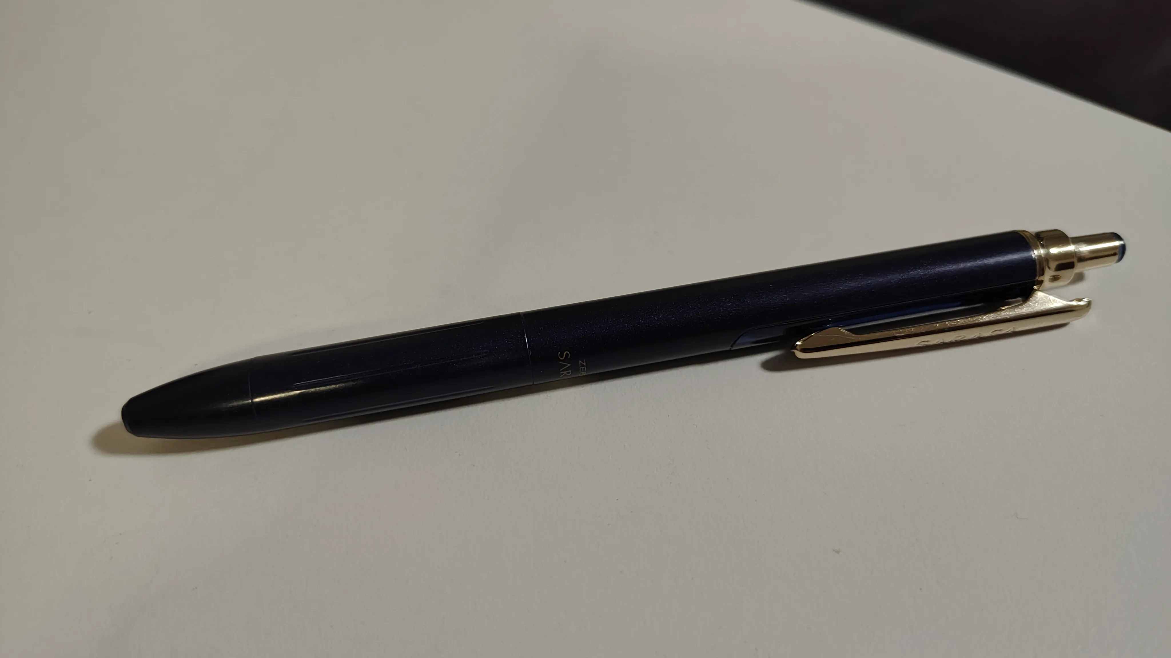 The Zebra Sarasa Grand body in dark blue. Samples of the Energel refill abound and won't have a risk of leaking sensitive information, so go find 'em yourself.